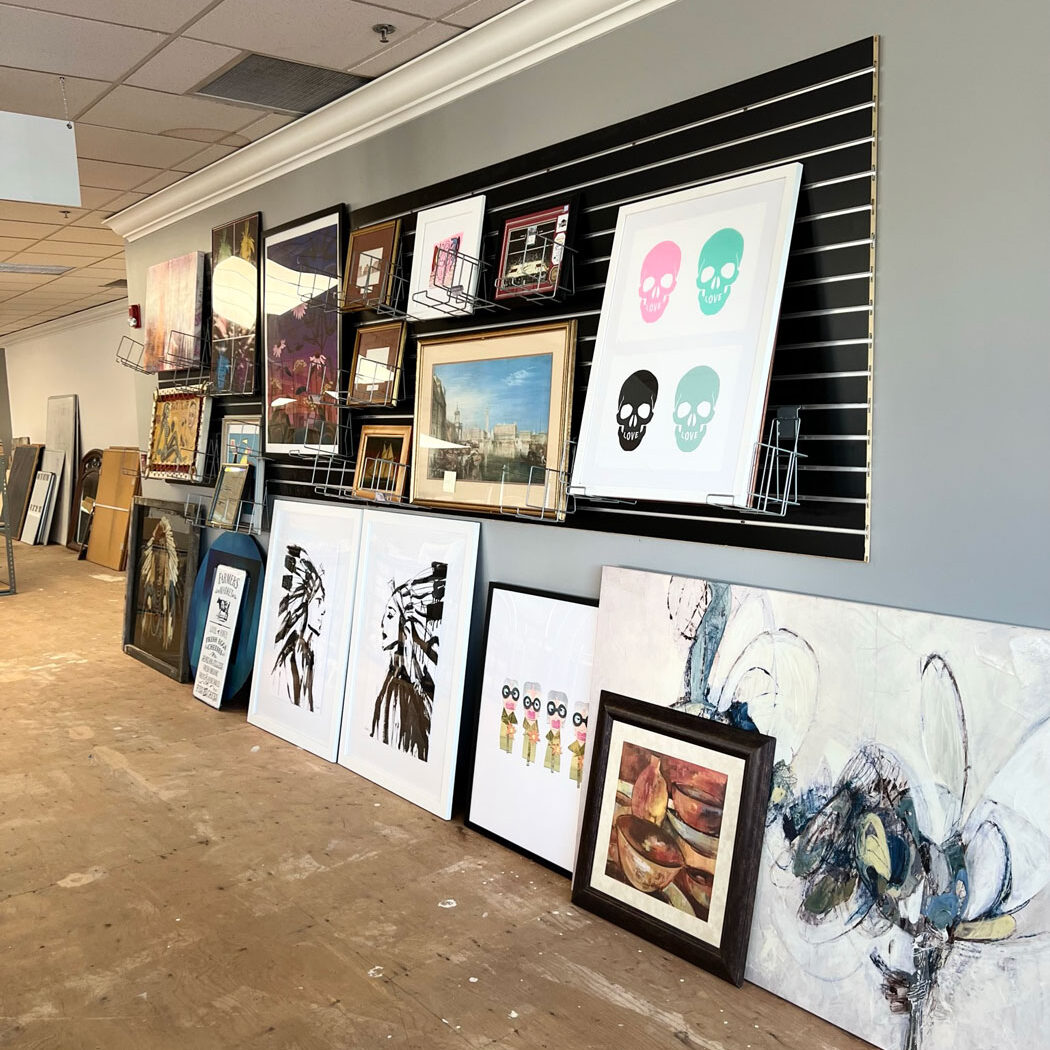 Art pictures hanging on a wall.