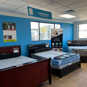 Sample mattresses displayed in a showroom.