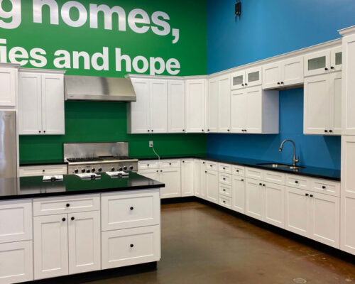 Fully remodeled kitchen with island for store sample viewing.