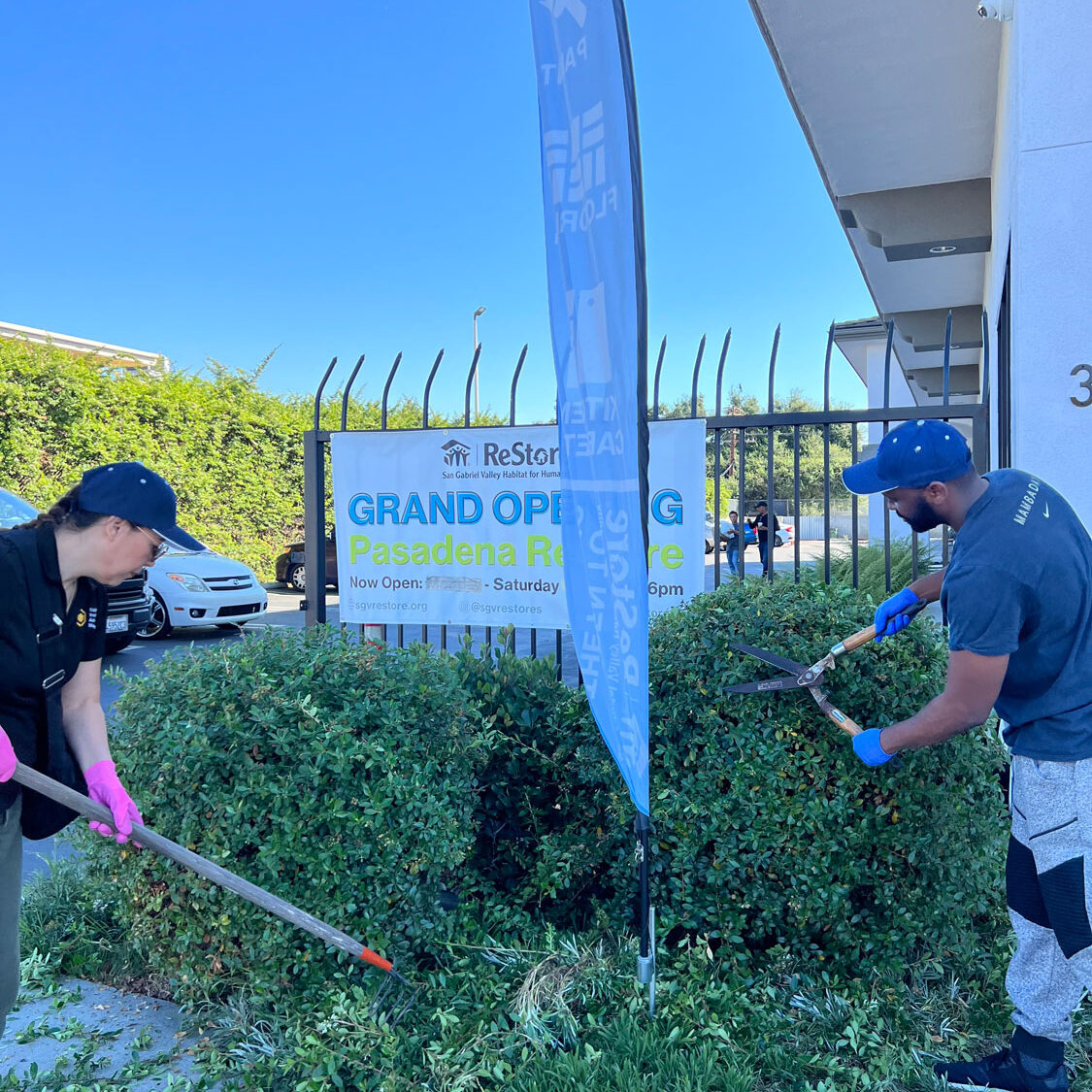 Volunteers doing outside maintenance.