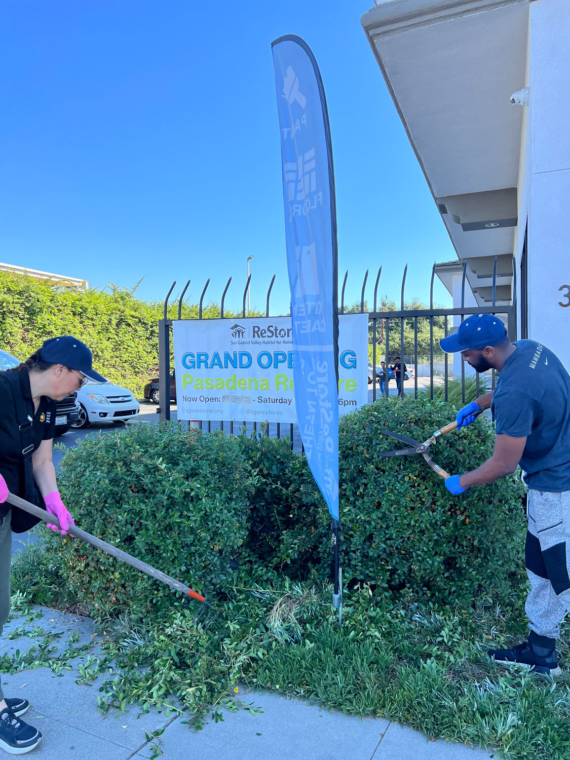 Volunteers doing outside maintenance.