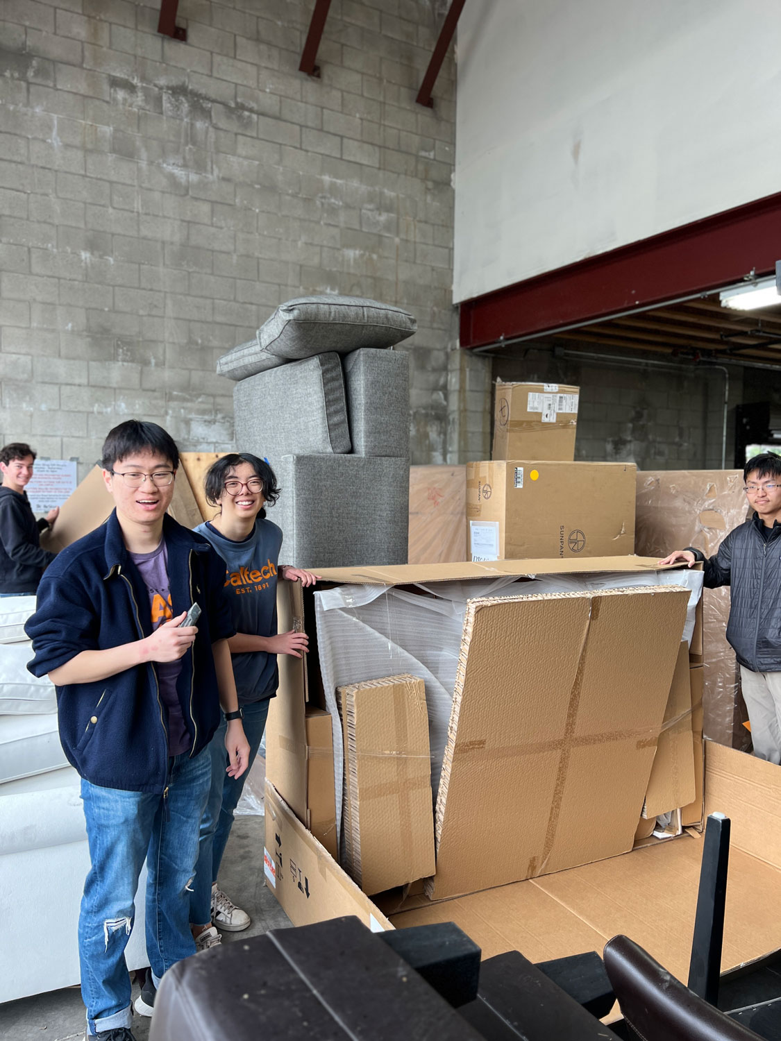 Young volunteers unloading boxes.